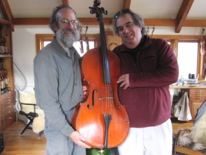 Doug Cox handing the Sonad cello to Eric Stumacher, 12/18/10